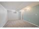 Cozy basement room with carpet flooring, neutral paint, and natural light at 9350 Raleigh Ct, Westminster, CO 80031