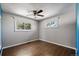 Bedroom features hardwood floors, a ceiling fan, and ample natural light at 9350 Raleigh Ct, Westminster, CO 80031