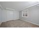 Carpeted bedroom with a large closet and a bright window at 9350 Raleigh Ct, Westminster, CO 80031