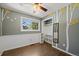 Bedroom features hardwood floors, stylish wall art, and a bright window view at 9350 Raleigh Ct, Westminster, CO 80031