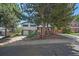 Charming two-story home featuring a stone facade, attached garage, and mature trees in a desirable neighborhood at 9350 Raleigh Ct, Westminster, CO 80031