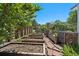 Backyard garden featuring terraced beds and stone pavers at 9350 Raleigh Ct, Westminster, CO 80031