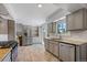 Spacious kitchen features stainless steel appliances, granite countertops, and tile flooring at 9350 Raleigh Ct, Westminster, CO 80031