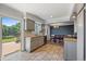 Well-appointed kitchen and dining area featuring stylish gray cabinetry, tile floors, and plenty of space for Gathering meals at 9350 Raleigh Ct, Westminster, CO 80031
