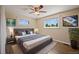 Staged bedroom with a comfortable bed, stylish decor, and ample natural light at 9350 Raleigh Ct, Westminster, CO 80031