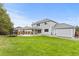 Expansive backyard with a covered patio, lush lawn, trampoline, and shed at 15483 W 51St Pl, Golden, CO 80403