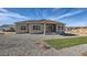 Backyard of home featuring large windows and sliding door and patio at 574 Agoseris Way, Castle Rock, CO 80104