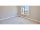 Simple bedroom with plush carpet and a view of the yard through the window at 574 Agoseris Way, Castle Rock, CO 80104