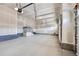 Spacious two car garage with automatic door opener and stairway to upper level at 574 Agoseris Way, Castle Rock, CO 80104