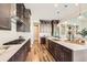 Modern kitchen with stainless steel appliances, white countertops, and wooden floors at 574 Agoseris Way, Castle Rock, CO 80104