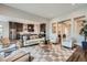 Open concept living room flowing into the kitchen, featuring hardwood floors and natural light at 574 Agoseris Way, Castle Rock, CO 80104