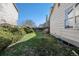 Green backyard featuring wood fence and lush bushes at 20451 Kelly Pl, Denver, CO 80249