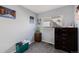 A bedroom with light blue walls and carpet featuring a large window with lots of light at 20451 Kelly Pl, Denver, CO 80249