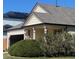 Charming home with a covered porch, attached garage, and well-maintained landscaping at 20451 Kelly Pl, Denver, CO 80249