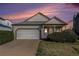 Charming single-Gathering home with a well-maintained lawn, two car garage and inviting entrance at 20451 Kelly Pl, Denver, CO 80249