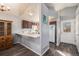 Open kitchen with ample counter space, dark cabinets and convenient access to the front door at 20451 Kelly Pl, Denver, CO 80249