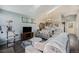 Comfortable living room next to the kitchen with hardwood floors and natural light at 20451 Kelly Pl, Denver, CO 80249
