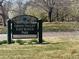 Sign for Green Valley East Ranch Park, with greenery and trees in the background at 20451 Kelly Pl, Denver, CO 80249