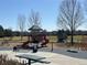 Community playground with a colorful slide, climbing structures, and picnic benches at 20451 Kelly Pl, Denver, CO 80249