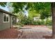 Relaxing backyard with a stone patio perfect for outdoor entertaining and dining at 5436 E Atlantic Pl, Denver, CO 80222