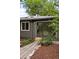 Detail of home's backyard, showing landscaping, glass door and stone patio at 5436 E Atlantic Pl, Denver, CO 80222