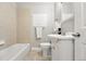 Bright bathroom with tiled floors and shower and large vanity at 5436 E Atlantic Pl, Denver, CO 80222