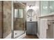 Bathroom featuring tiled shower and modern vanity with sleek fixtures at 5436 E Atlantic Pl, Denver, CO 80222