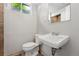Basement bathroom with toilet and sink at 5436 E Atlantic Pl, Denver, CO 80222