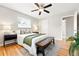 Bright bedroom features hardwood floors, a ceiling fan, and plenty of natural light at 5436 E Atlantic Pl, Denver, CO 80222