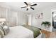 Bedroom featuring hardwood floors, neutral paint, en suite bathroom, and closet at 5436 E Atlantic Pl, Denver, CO 80222