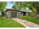 Lovely home with attached garage, lush lawn, and mature trees at 5436 E Atlantic Pl, Denver, CO 80222