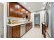 Spacious kitchen featuring wood cabinets, granite countertops, and stainless steel appliances at 5436 E Atlantic Pl, Denver, CO 80222