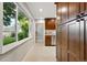 Bright kitchen space with stainless steel dishwasher, tile floor, and large window to the back yard at 5436 E Atlantic Pl, Denver, CO 80222