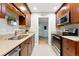 Spacious kitchen featuring wood cabinets, granite countertops, and stainless steel appliances at 5436 E Atlantic Pl, Denver, CO 80222
