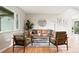 Comfortable living room featuring stylish decor and large window at 5436 E Atlantic Pl, Denver, CO 80222
