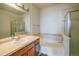 Bathroom featuring a bathtub and shower combination, a vanity, and tile accents at 13456 Via Varra # 225, Broomfield, CO 80020