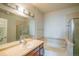 Bathroom featuring a bathtub and shower combination, a vanity, and tile accents at 13456 Via Varra # 225, Broomfield, CO 80020