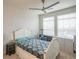 Bright bedroom with a ceiling fan, large windows, and ample space for furniture at 13456 Via Varra # 225, Broomfield, CO 80020