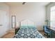 Comfortable bedroom with a ceiling fan, large windows, and a convenient desk area at 13456 Via Varra # 225, Broomfield, CO 80020