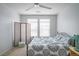Cozy bedroom featuring a decorative screen, plush bedding, and a ceiling fan at 13456 Via Varra # 225, Broomfield, CO 80020