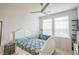 Bright bedroom with a ceiling fan, large windows, and ample space for furniture at 13456 Via Varra # 225, Broomfield, CO 80020