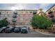 Multi-story condominium building with parking and colorful facade at 13456 Via Varra # 225, Broomfield, CO 80020