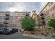 Multi-story condominium building showing exterior and professional landscaping at 13456 Via Varra # 225, Broomfield, CO 80020