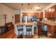 Kitchen features a large breakfast bar with granite countertops and stainless steel appliances at 13456 Via Varra # 225, Broomfield, CO 80020