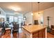 Spacious living room with hardwood floors offering a great open space that leads to the kitchen at 13456 Via Varra # 225, Broomfield, CO 80020