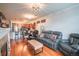 Inviting living area with hardwood floors, neutral paint, and stylish furnishings at 13456 Via Varra # 225, Broomfield, CO 80020
