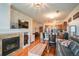 Bright living area with fireplace and open access to kitchen area at 13456 Via Varra # 225, Broomfield, CO 80020
