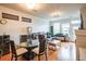 Bright and open living room with hardwood floors and access to an outdoor balcony space at 13456 Via Varra # 225, Broomfield, CO 80020