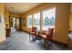 Comfortable lobby area with views of the pool; features chairs, accent table, and slate flooring at 13456 Via Varra # 225, Broomfield, CO 80020