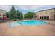 Community pool and lounge area with comfortable seating, and shade umbrellas near the apartments at 13456 Via Varra # 225, Broomfield, CO 80020